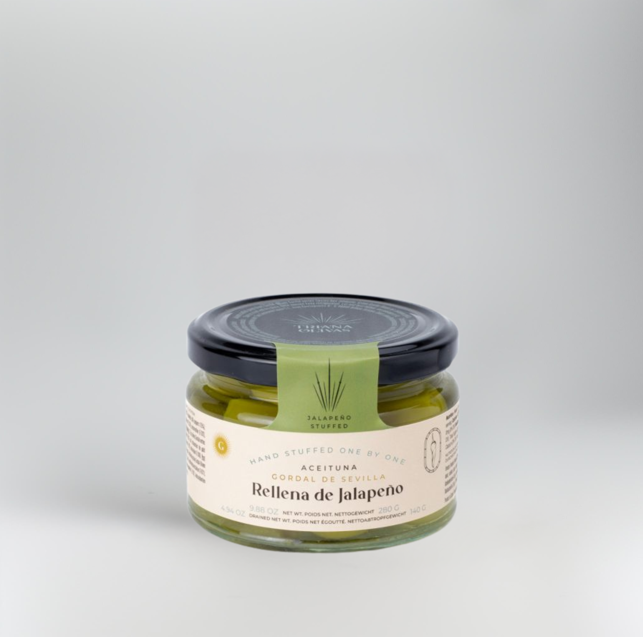 Jar of Relena de Jalapeno on a light gray background