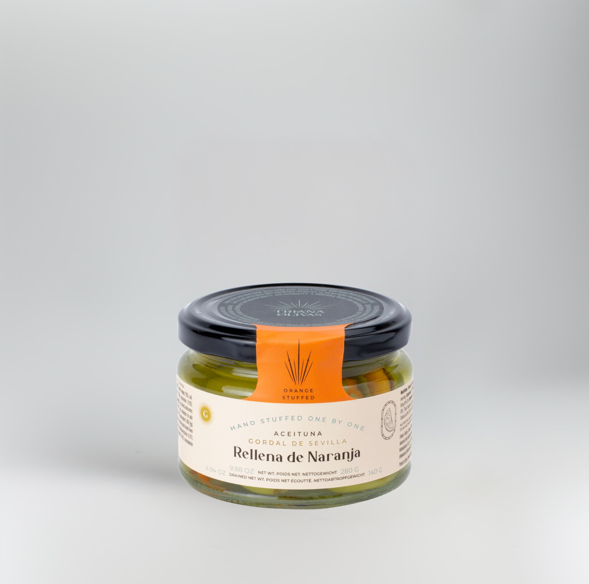 Jar of 'Relena de Naranja' with an orange label on a gray background