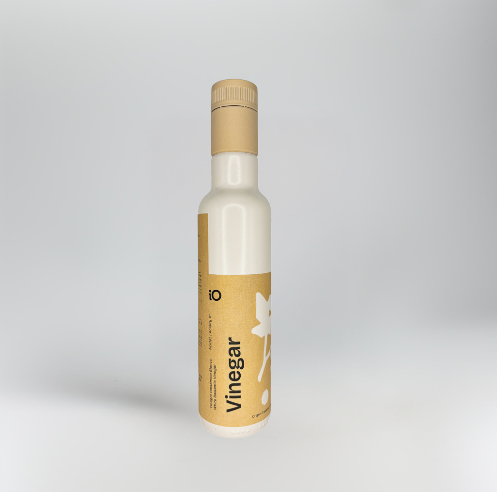 Bottle of vinegar with a brown label on a white background