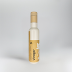 Bottle of vinegar with a brown label on a white background